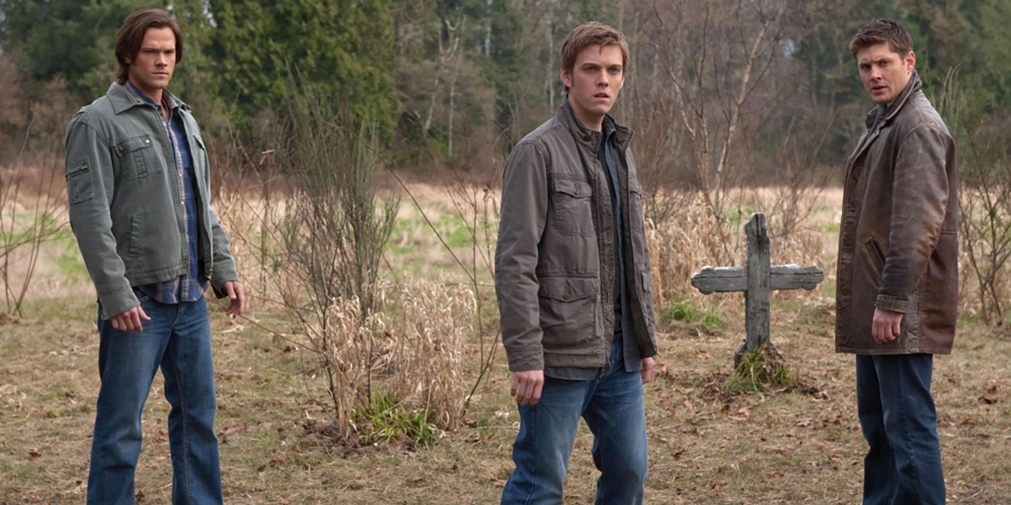 Sam, Dean, and Adam stand in a graveyard on Supernatural