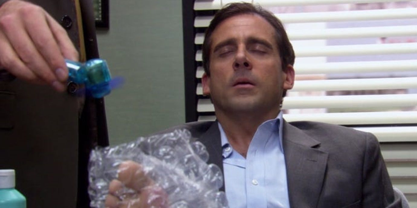 An image of Dwight fanning Michael's foot in The Office
