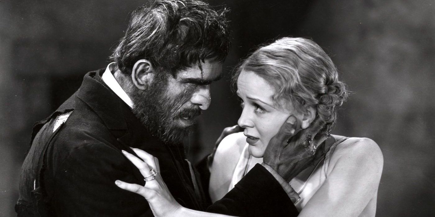 A bearded man holds a frightened woman from the Old Dark House
