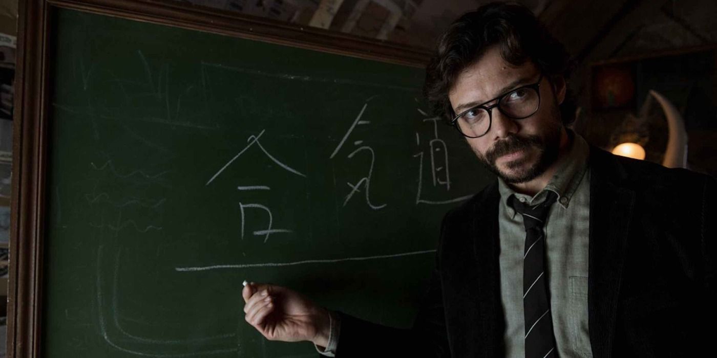 The Professor stands in front of a chalkboard in Money Heist.