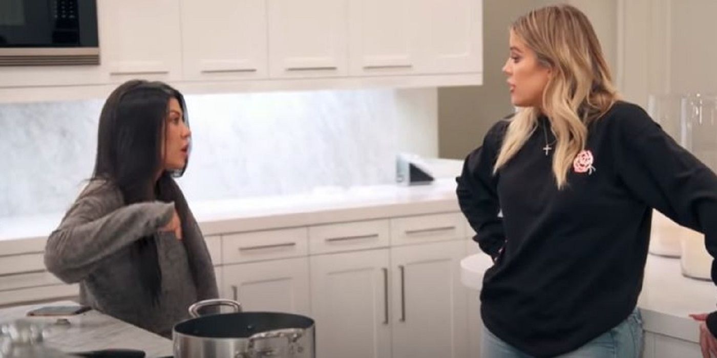 Kourtney and Khloe talking in a kitchen on KUWTK