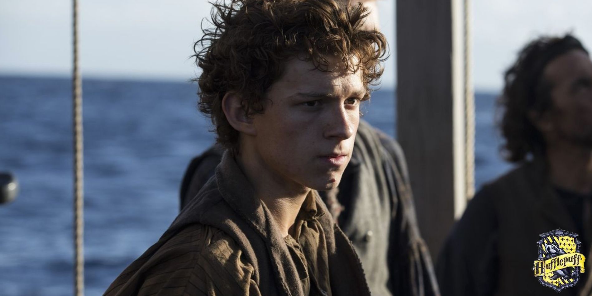 Tom Holland As Thomas Nickerson In The Heart Of The Sea on a ship.