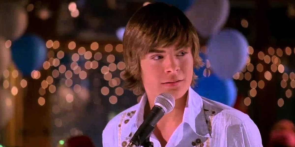 Troy Bolton at a microphone