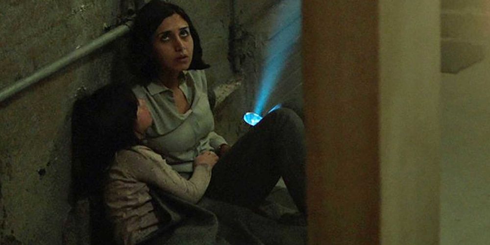 A mother and daughter wait in the dark in Under The Shadow