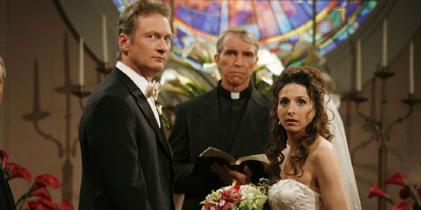 Judith in a wedding dress and Herb in a tux staring at the camera from the altar in Two and a Half Men