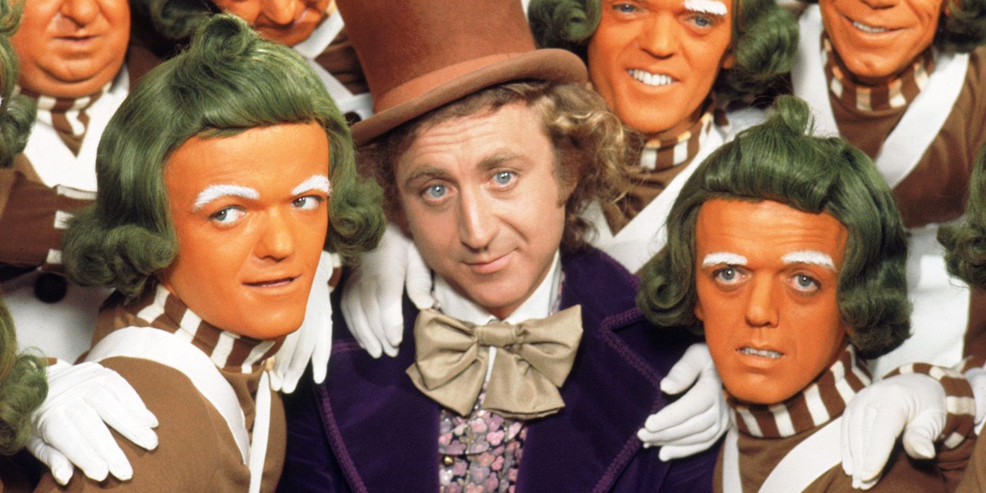 Willy Wonka with his oompa loompas