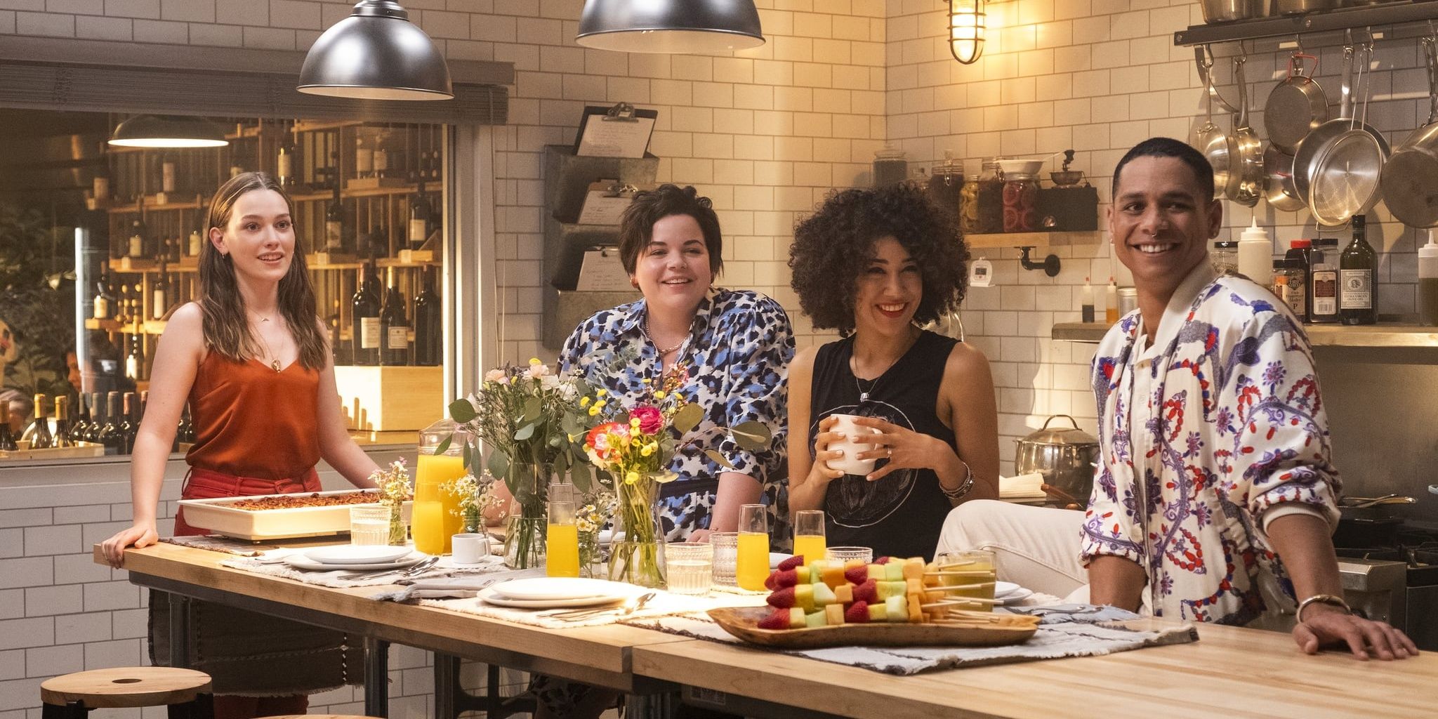 Love and her friends stand in her kitchen in YOU.