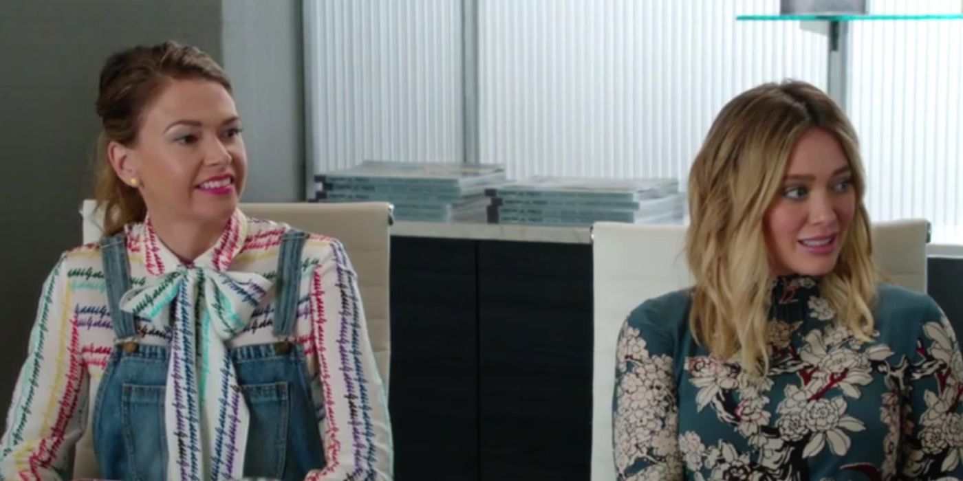 Liza and Kelsey sitting in a meeting on Younger