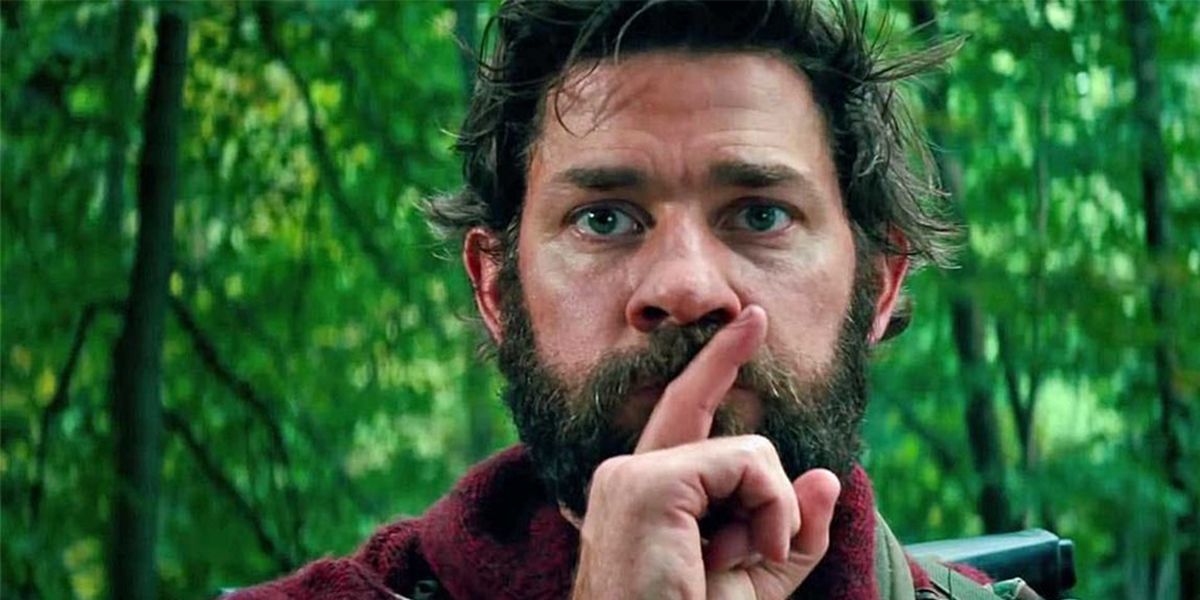 John Krasinski holding his finger to his lips in A Quiet Place