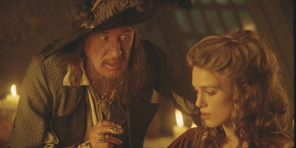Barbossa and Elizabeth talk while having dinner in Pirates of the Caribbean 1