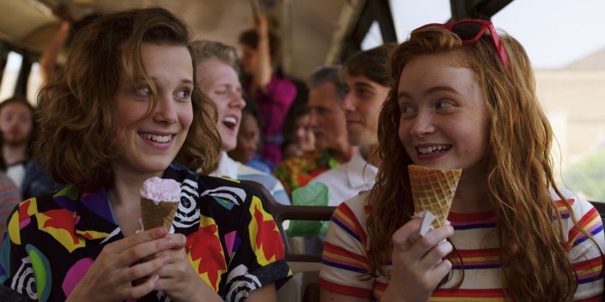 Eleven and Max eating ice cream on the bus in Stranger Things
