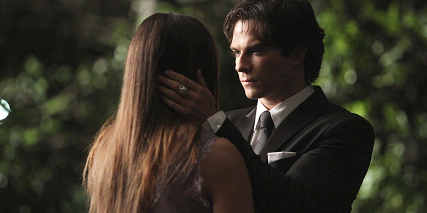 Damon looks at Elena on the side of the road in The Vampire Diaries
