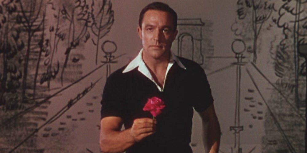 Jerry Mulligan holding a rose in An American in Paris