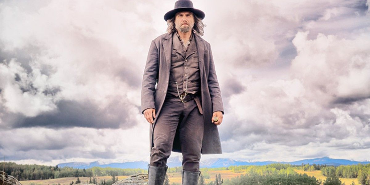 Bohanan stands in front of a cloudy sky in Hell on Wheels