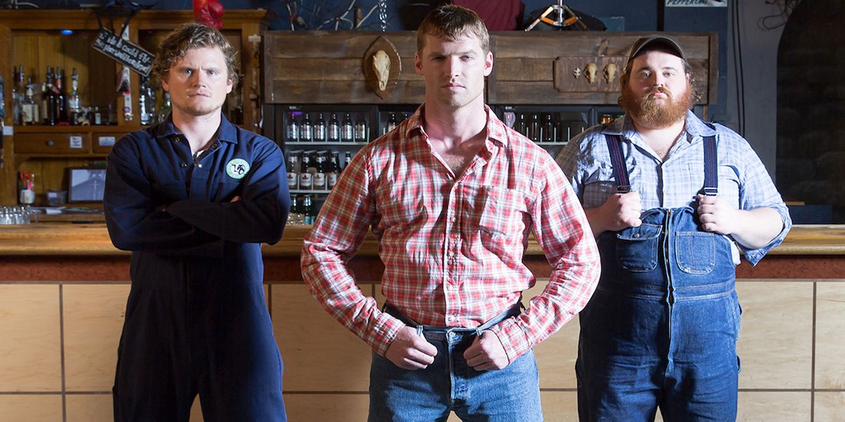 Three Letterkenny characters standing in front of a bar