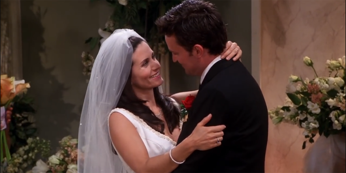 Monica and Chandler hugging on their wedding day on Friends