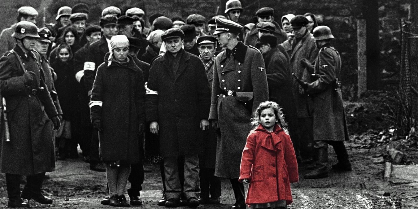The girl in the red coat walks with a crowd in Schindler's List