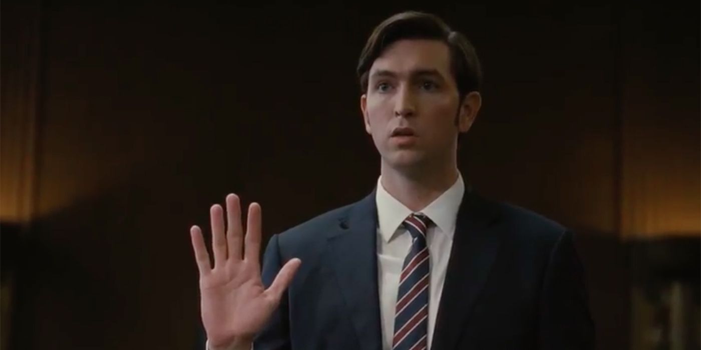 Greg raising his hand to testify in Succession
