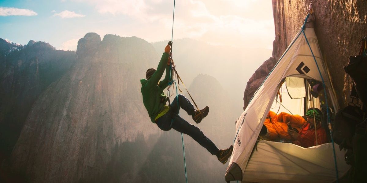 An image of climber abseiling down a mountain in the Dawn Wall