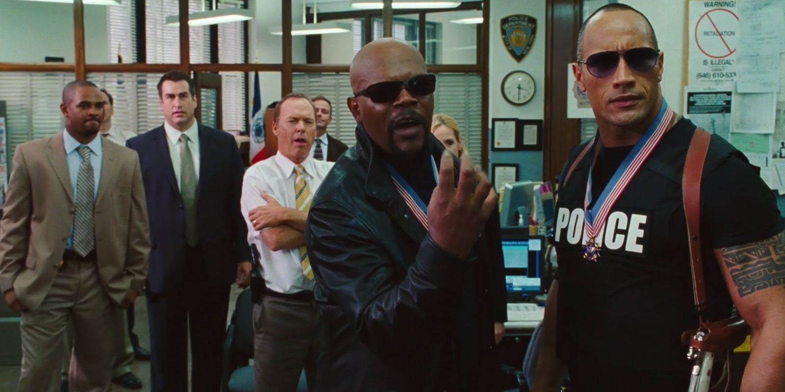 PK and Chris flaunt their success in a police station in The Other Guys