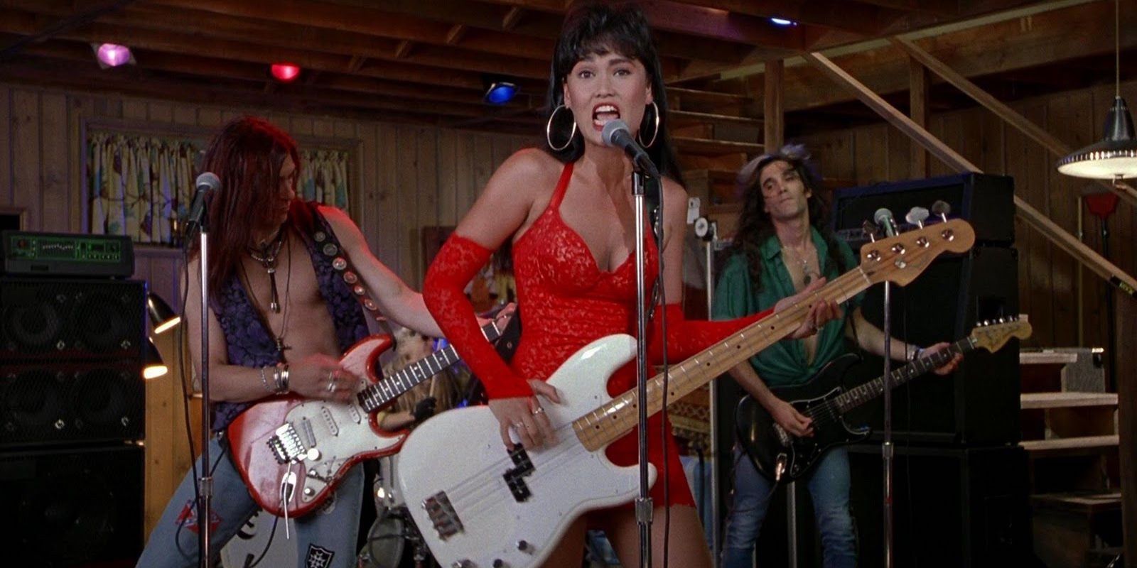 Cassandra shreds on bass while singing &quot;Ballroom Blitz&quot; with Crucial Taunt in Wayne's World.