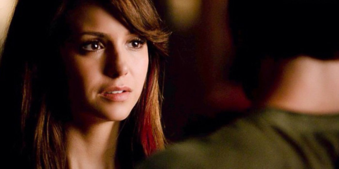 Elena looks on at Damon with tears on The Vampire Diaries