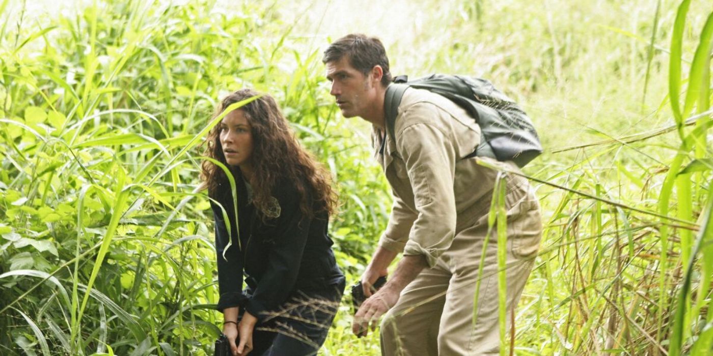 Kate and Jack crouching in the forest in Lost