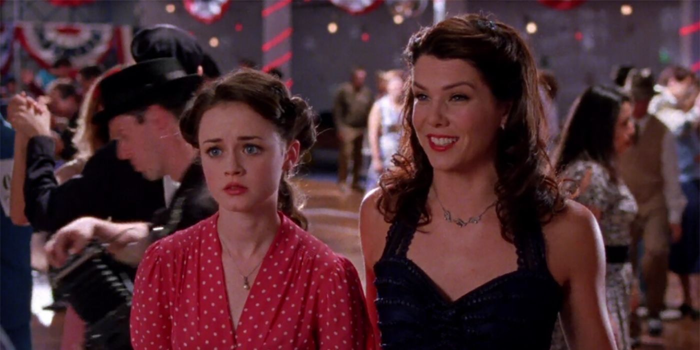 Rory and Lorelai standing at the dance-a-thon on Gilmore Girls