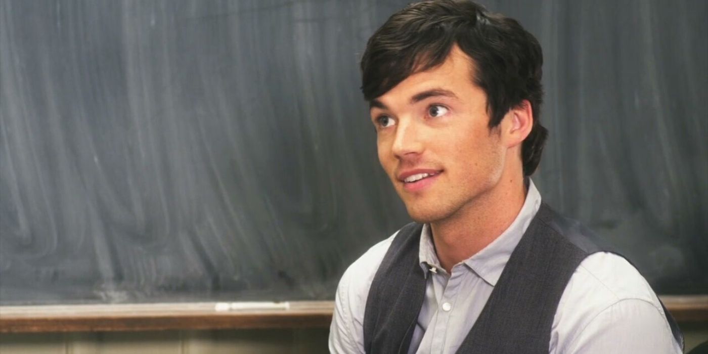 Ezra standing in front of his blackboard in his classroom on Pretty Little Liars
