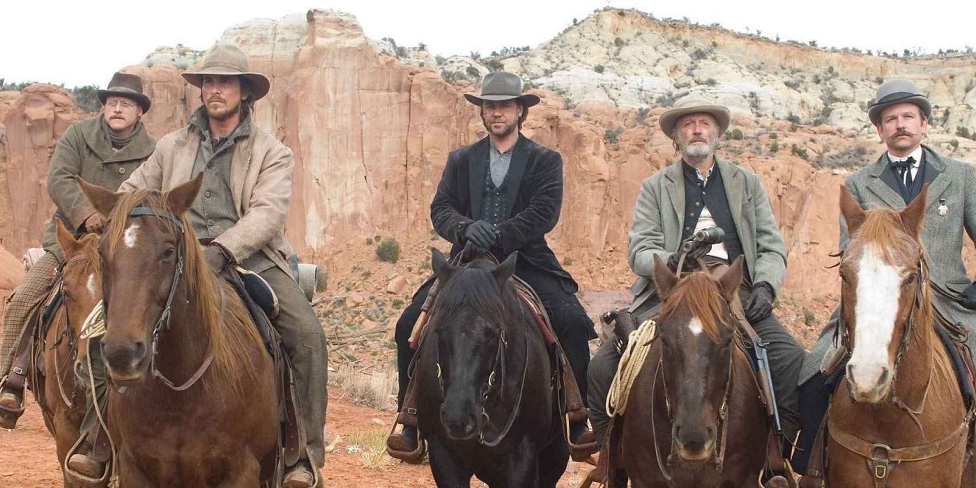 A posse riding in the desert on horses in 3:10 to Yuma