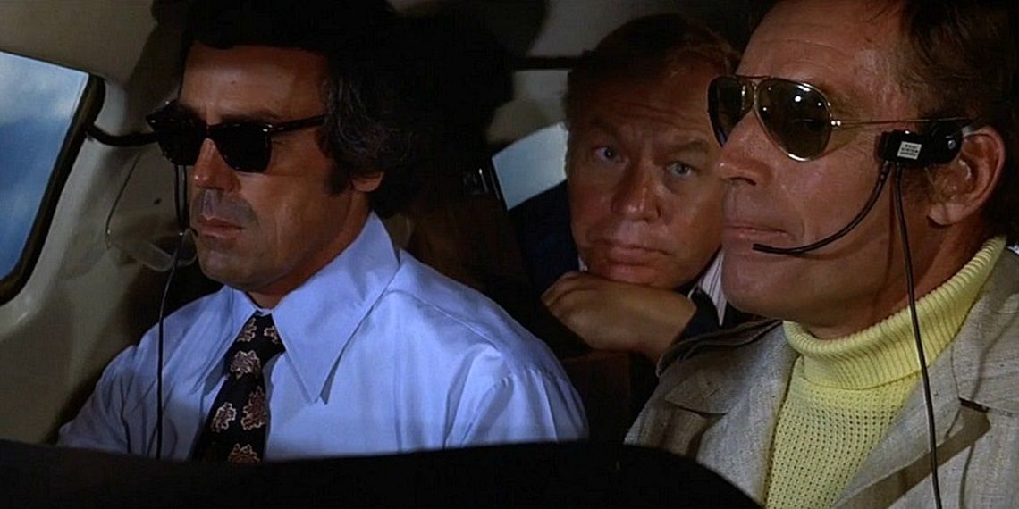Two characters flying a plane wearing sunglasses in Airport 1975