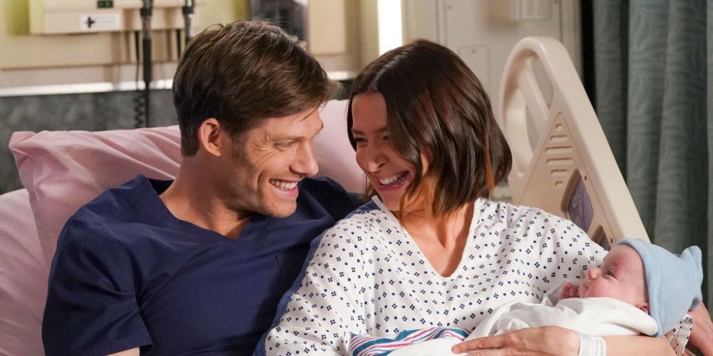 Link and Amelia with their baby Scout in the hospital in Grey's Anatomy