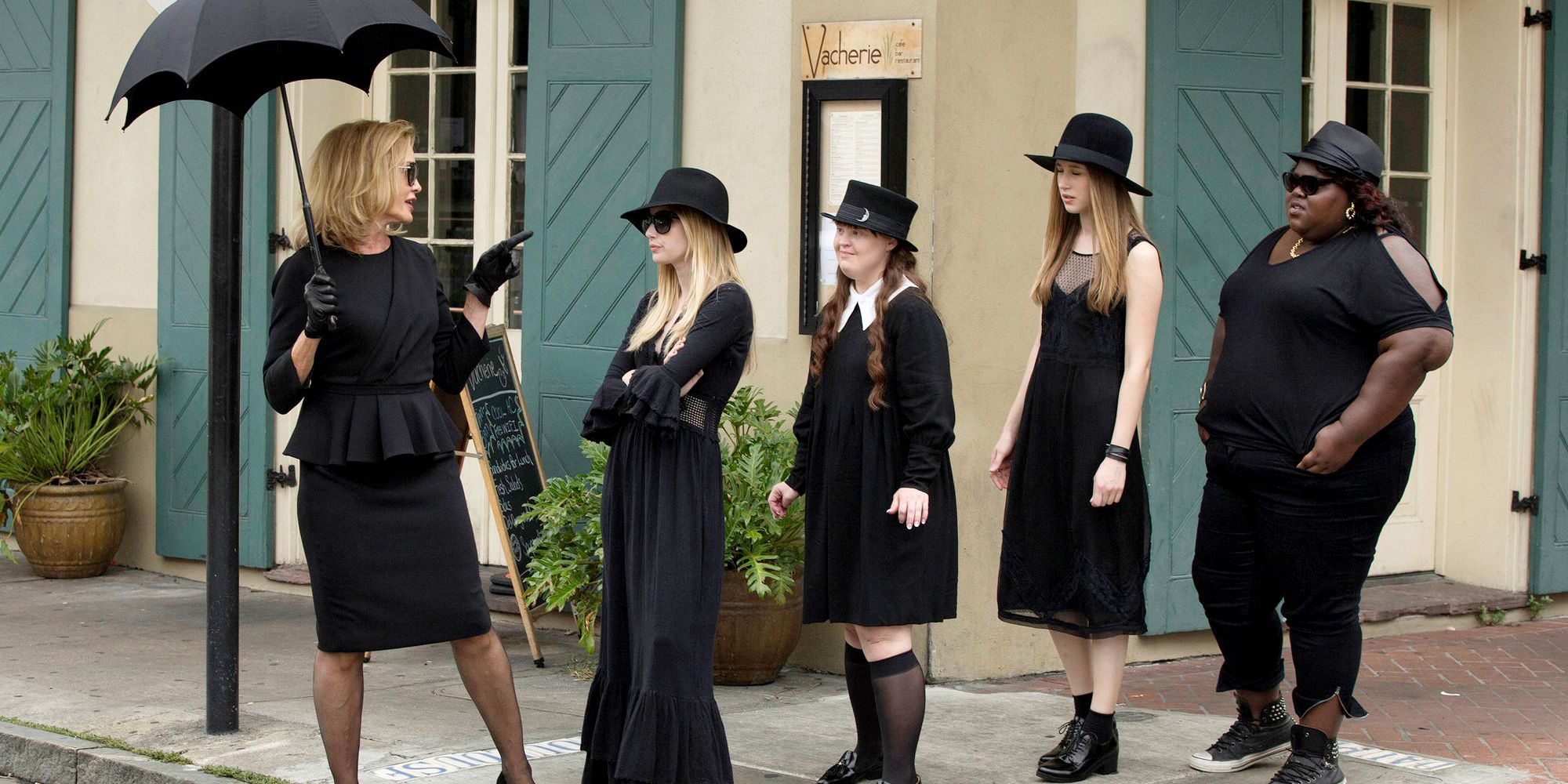 The witches walk in line in American Horror Story Coven