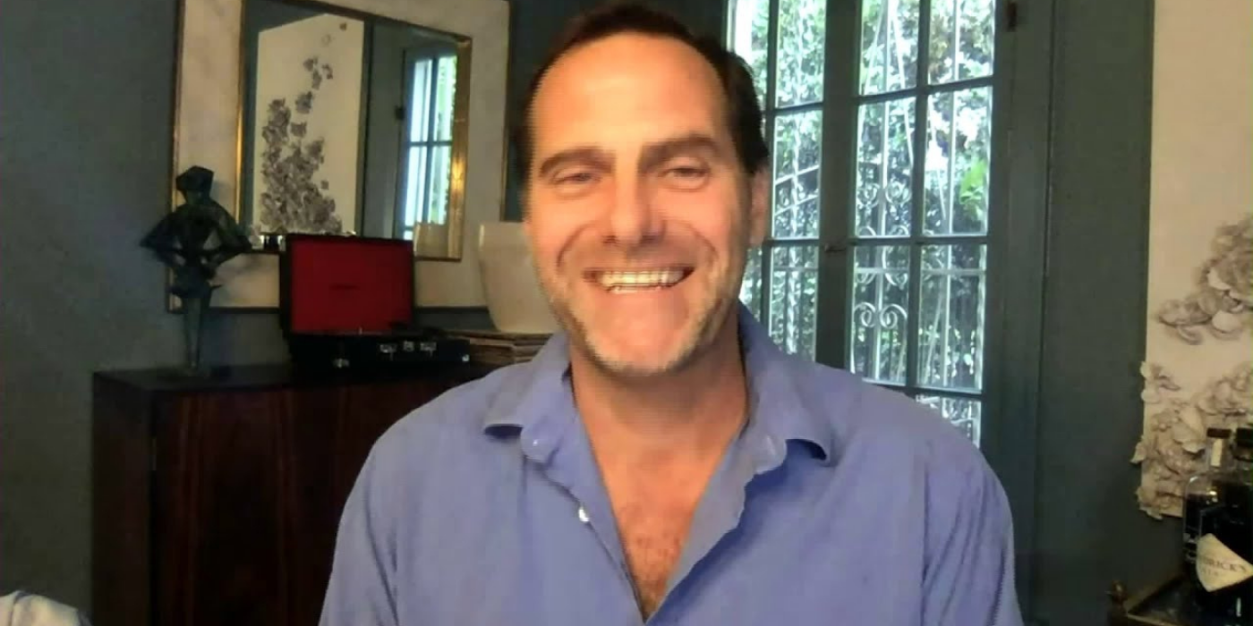 Andy Buckley smiling in an online interview from The Office