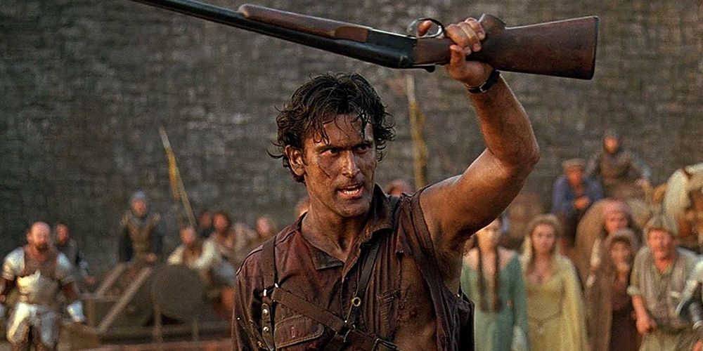 Ash holding his boomstick aloft to show it to the crowd in Army of Darkness