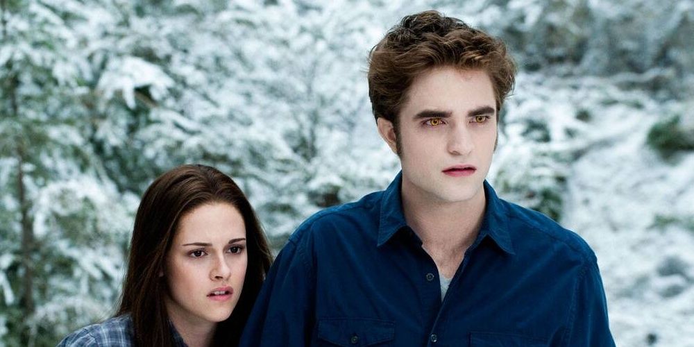 Bella and Edward standing in the snow in Twilight.