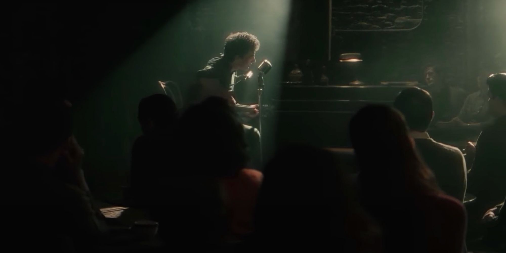Bob Dylan sings on-stage at the Gaslight Cafe in Inside Llewyn Davis