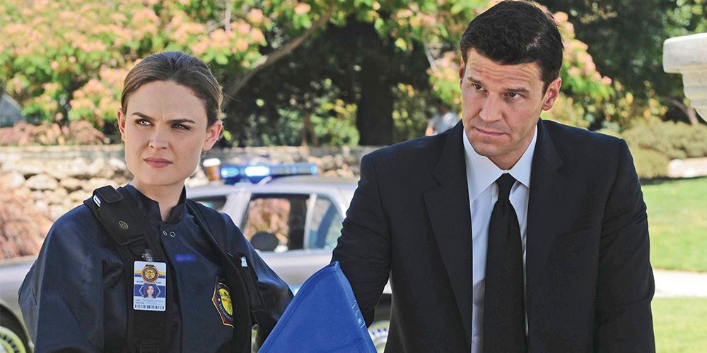 Bones and Booth look on at a crime scene from Bones