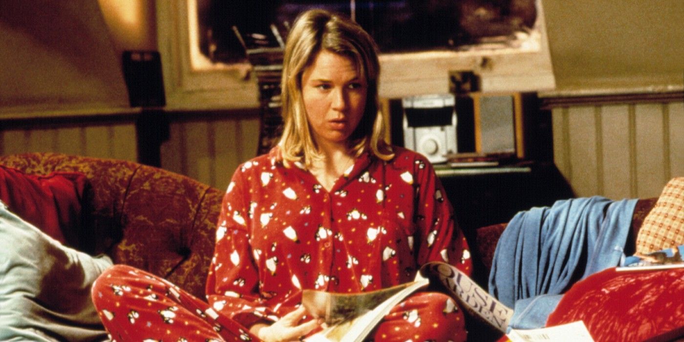 Bridget Jones sat on her sofa in her pyjamas