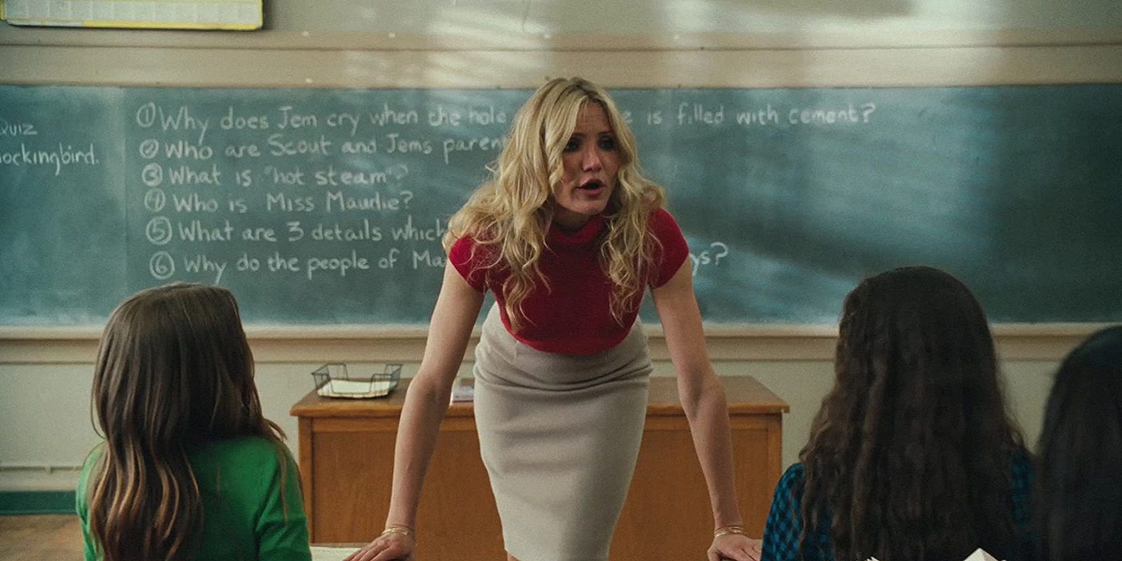 Elizabeth (Cameron Diaz) leaning over a desk and looking angry in Bad Teacher