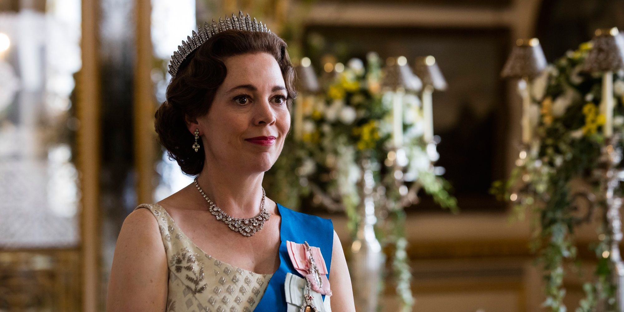 Queen Elizabeth smiling in The Crown