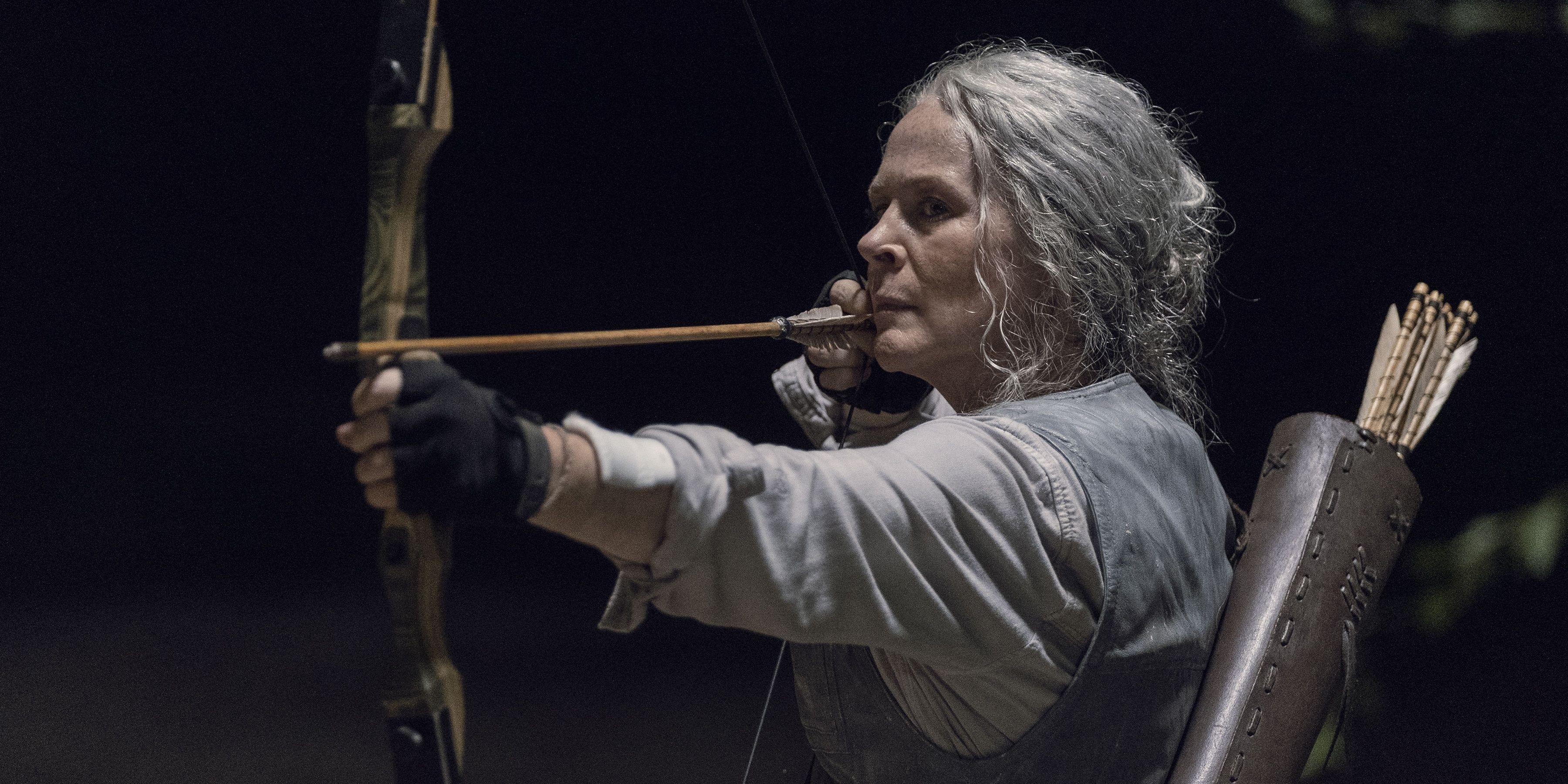 Carol with a bow and arrow in The Walking Dead