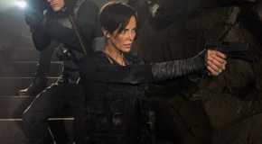 Charlize Theron pointing a gun in The Old Guard
