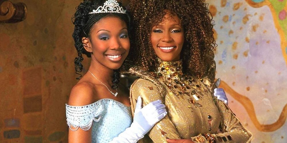 Cinderella (Brandy) posing with the Fairy Godmother (Whitney Houston)