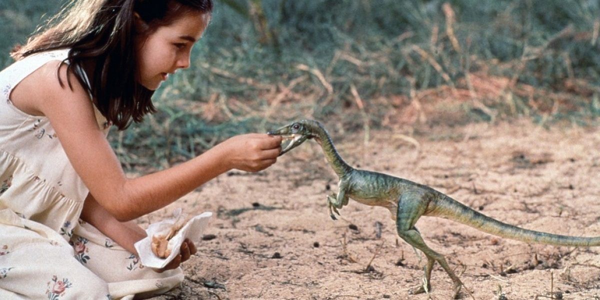 Girl feeding compies in The Lost World