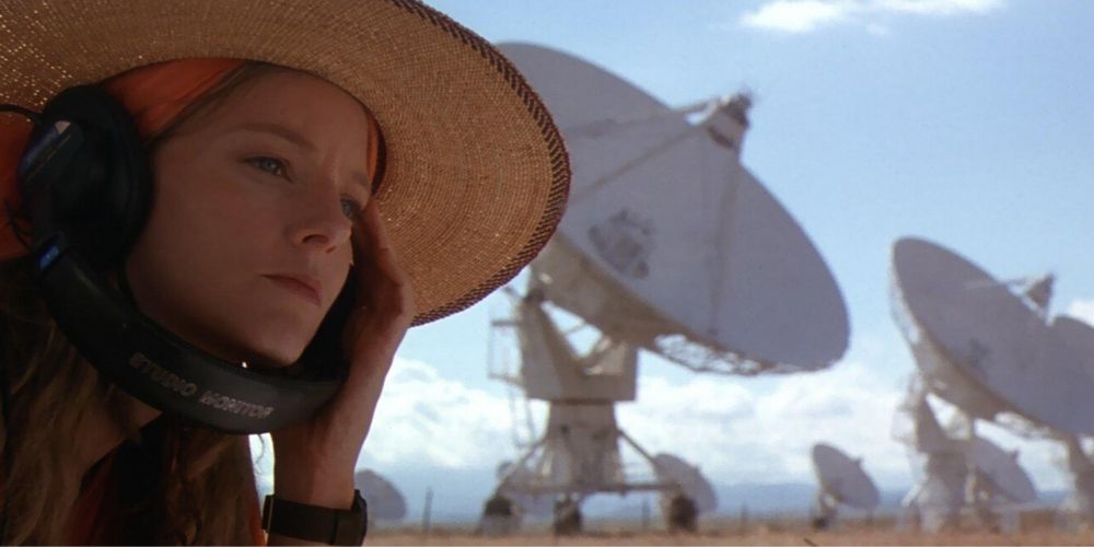 Jodie Foster listening to headphones near satellites in Contact