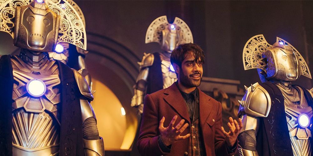 Sacha Dhawan as The Master surrounded by Cybermen