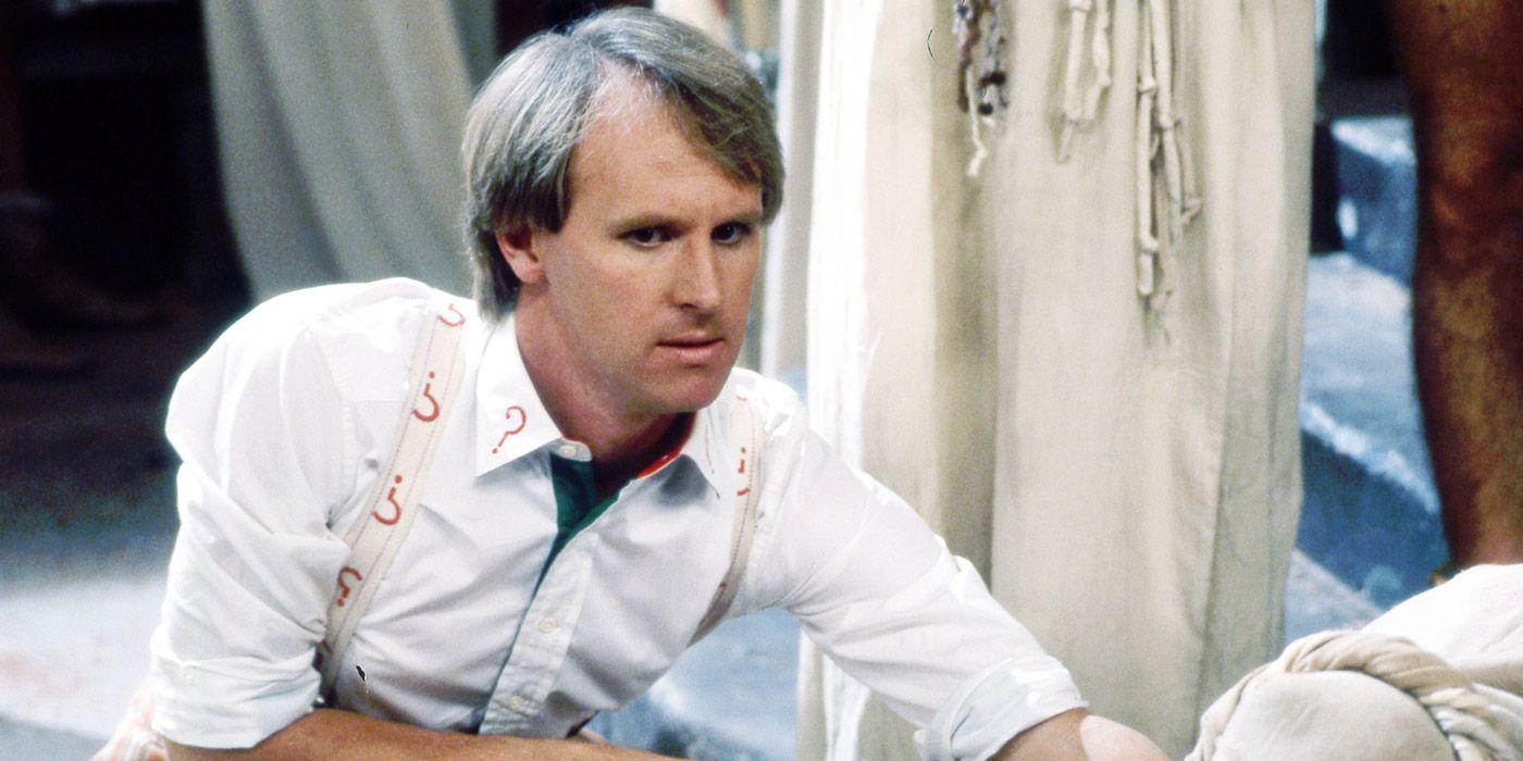 Peter Davison as the Fifth Doctor Who looking on 
