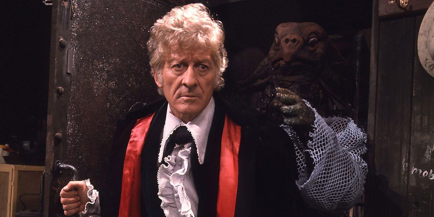 A Sea Devil sneaks up on the Third Doctor in Doctor Who