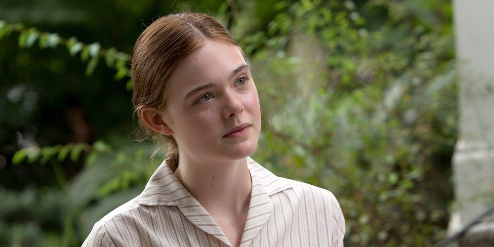 Elle Fanning looking at something in Trumbo